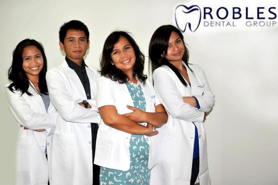 Dra Annabelle Robles with her children, all dentists
